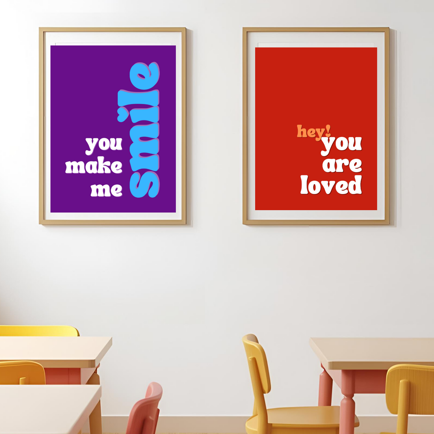 Two framed posters on a wall with motivational phrases in a classroom setting.