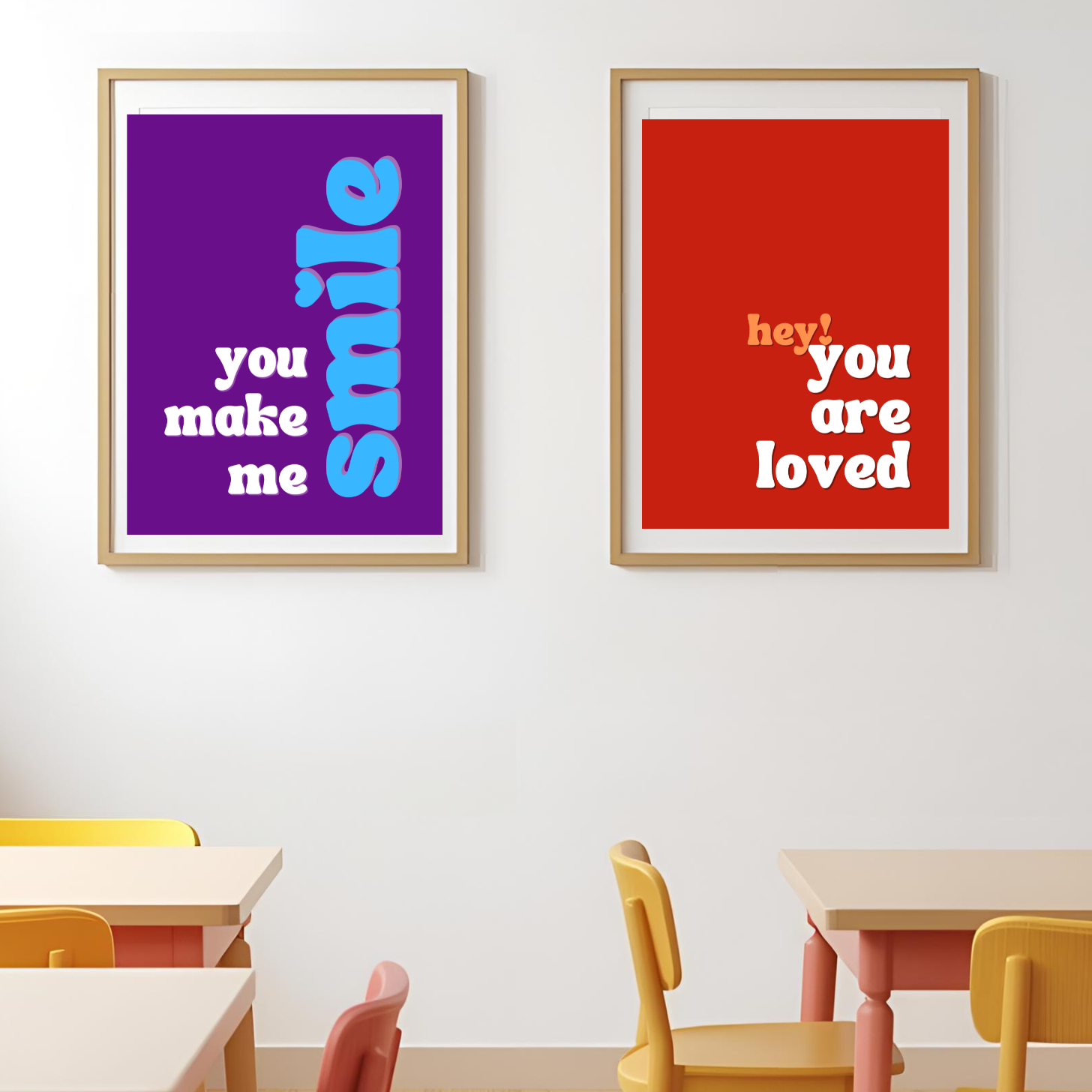 Two framed posters on a wall with motivational phrases in a classroom setting.