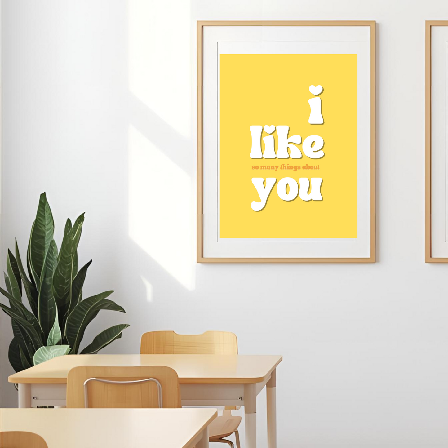 Two framed posters on a wall with educational furniture below