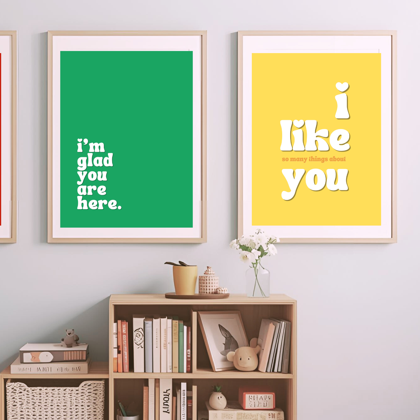 Three framed posters with motivational phrases in a living room setting.