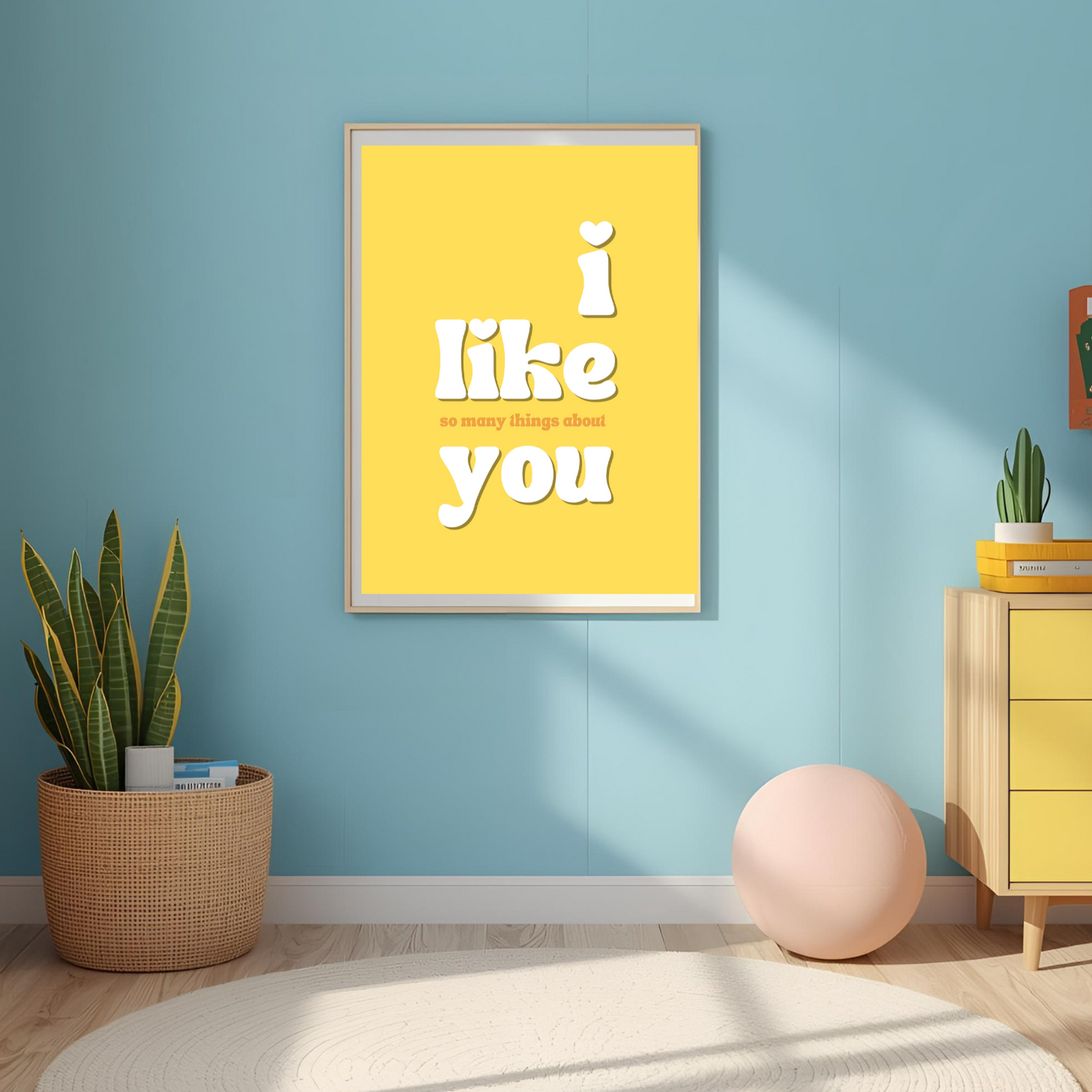 Yellow framed poster with 'i like you' text in a room with a blue wall, yellow cabinet, and plants.